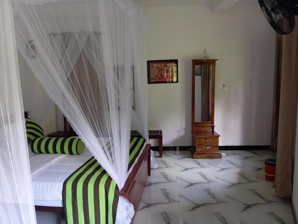 Postel nebo postele na pokoji v ubytování Forest Paddy Homestay