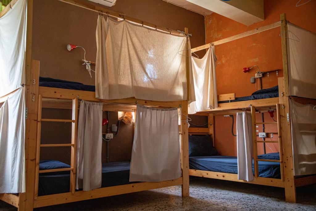 Postel nebo postele na pokoji v ubytování Dulan Tranquilo Hostel 台東都蘭晃輕鬆背包客棧