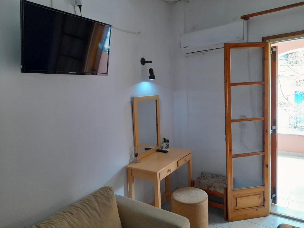 TV a/nebo společenská místnost v ubytování Paradise Studios