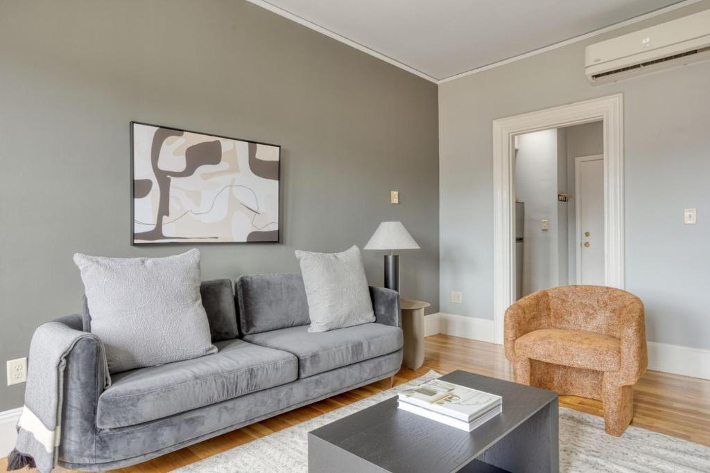 a living room with a couch and a table at Back Bay 1br w wd nr Newbury St BOS-725 in Boston