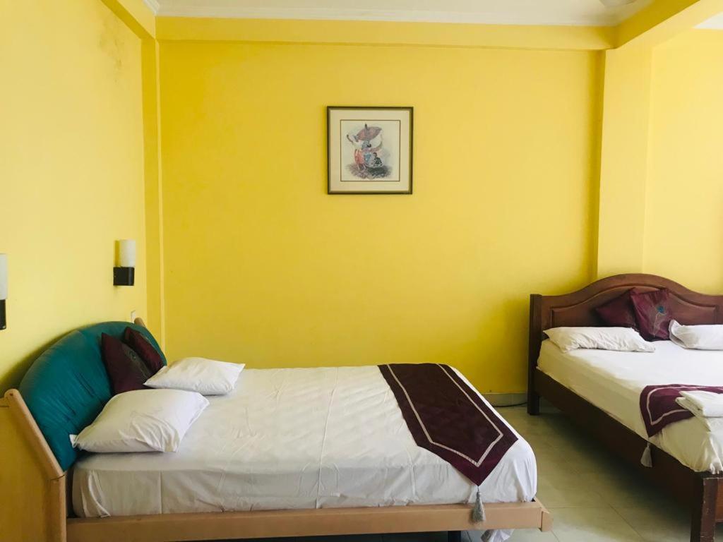 Postel nebo postele na pokoji v ubytování Suisse View Residence Kandy