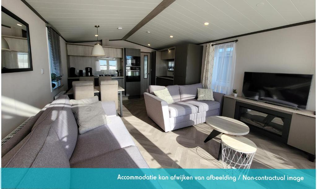 TV a/nebo společenská místnost v ubytování Siblu camping Lauwersoog