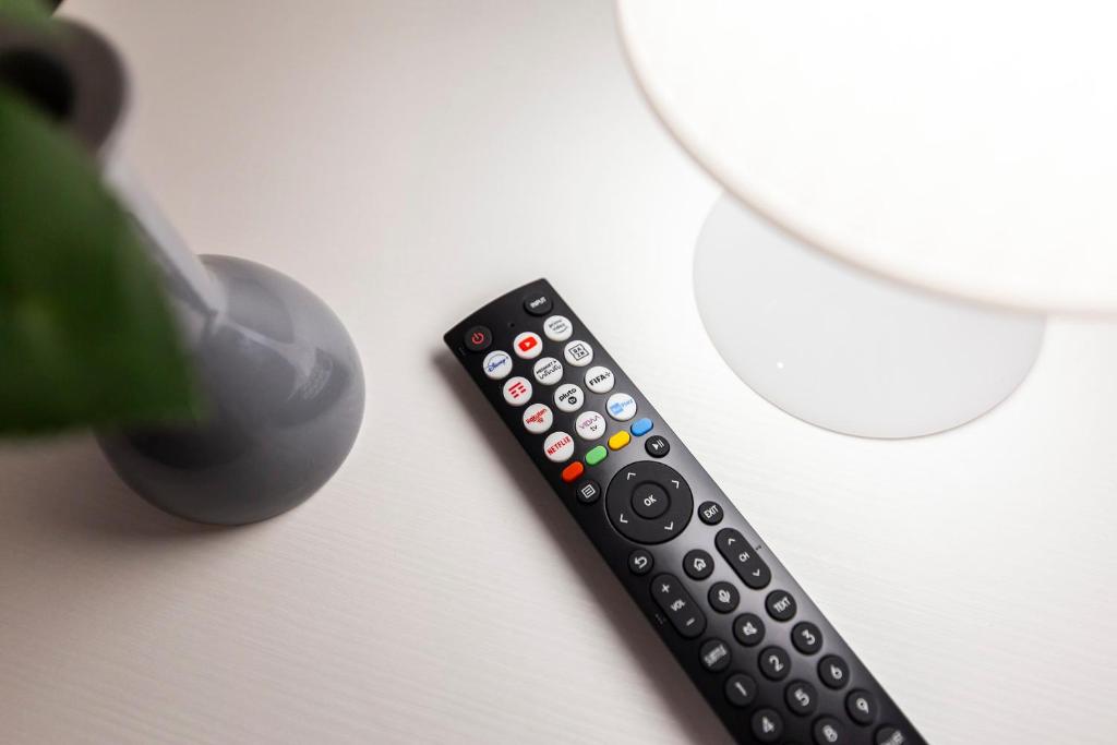 TV a/nebo společenská místnost v ubytování Trilocale Noverasco IEO 1