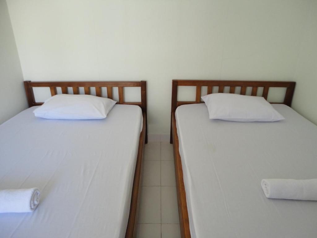 Postel nebo postele na pokoji v ubytování Jazz Senggigi Hotel