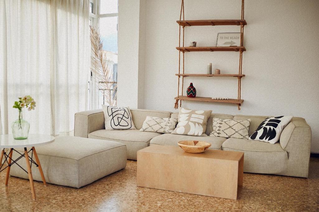a living room with a couch and a table at Maison Dya Altea in Altea