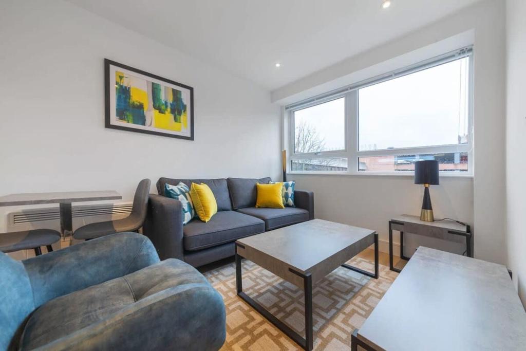 a living room with a couch and a table at Contemporary Studio in Central East Grinstead in East Grinstead