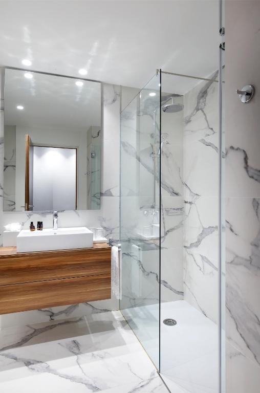 a bathroom with a sink and a mirror at Hotel SB Icaria in Barcelona