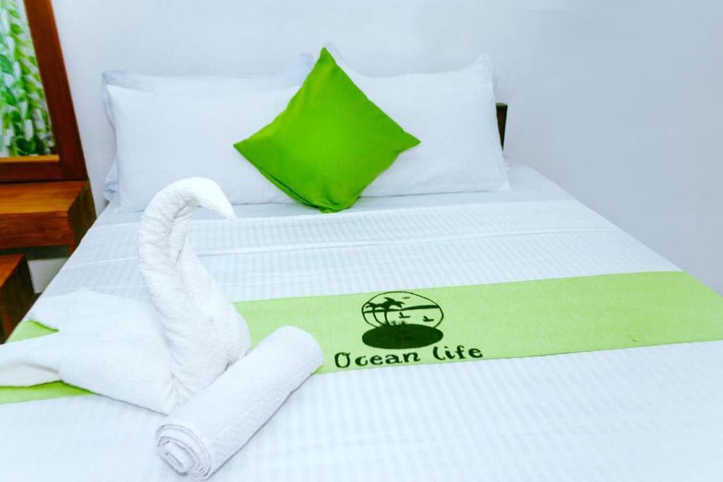 Postel nebo postele na pokoji v ubytování Ocean Life Talalla