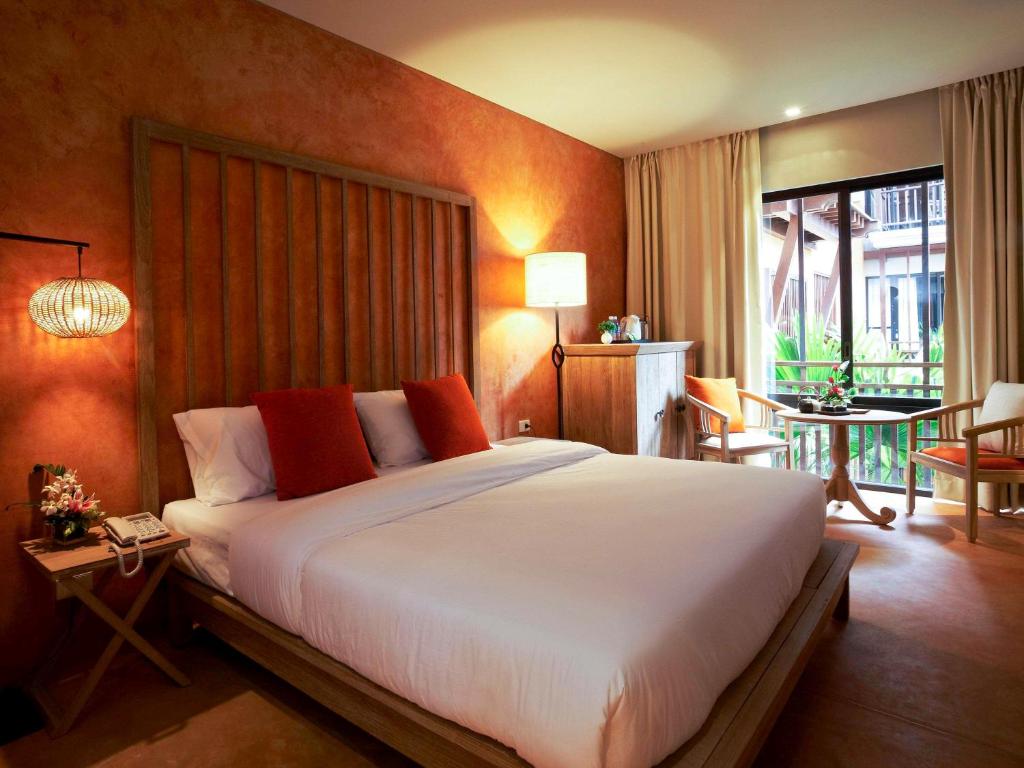 Postel nebo postele na pokoji v ubytování Mercure Samui Chaweng Tana