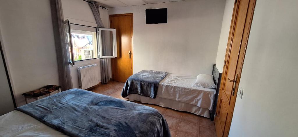 Postel nebo postele na pokoji v ubytování Fonda Toldra