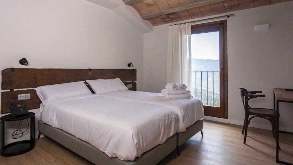 Postel nebo postele na pokoji v ubytování Abbatissa Hotel Restaurant