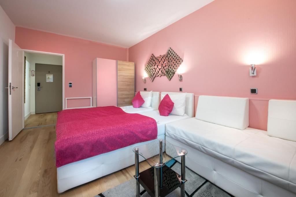 Postel nebo postele na pokoji v ubytování Hotel Rivoli Charme