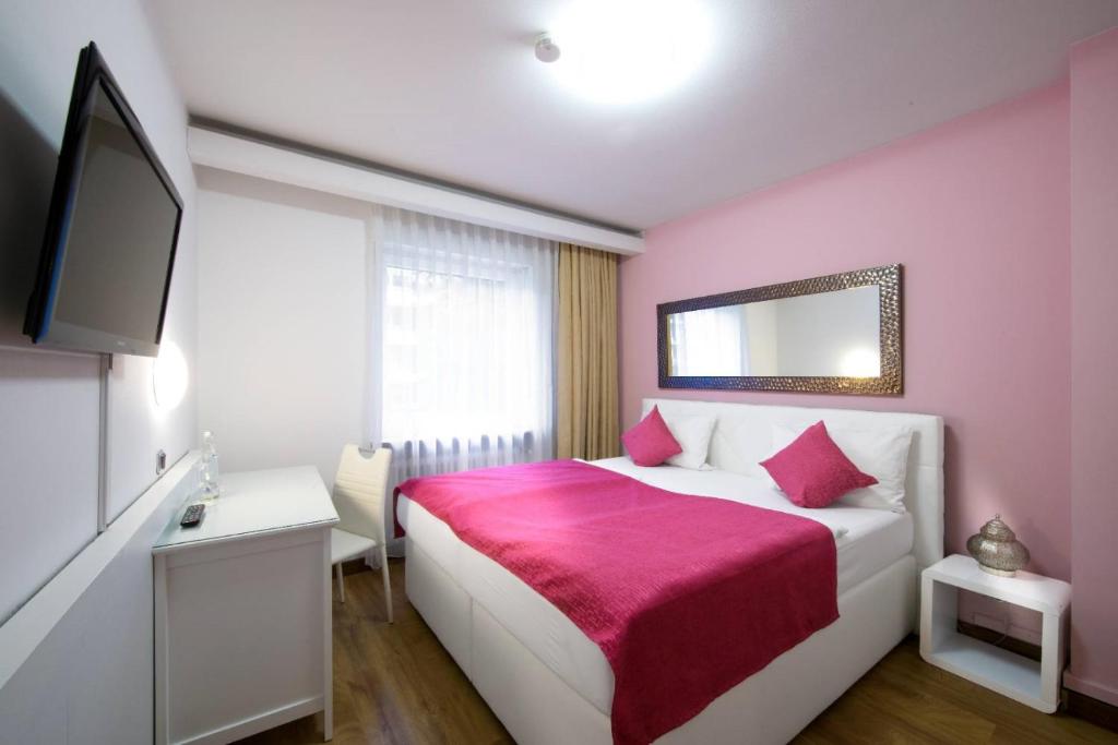 Postel nebo postele na pokoji v ubytování Hotel Rivoli Charme