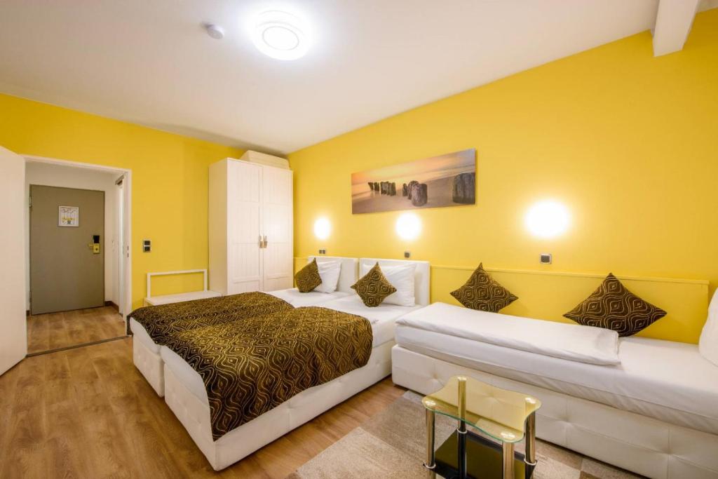 Postel nebo postele na pokoji v ubytování Hotel Rivoli Charme