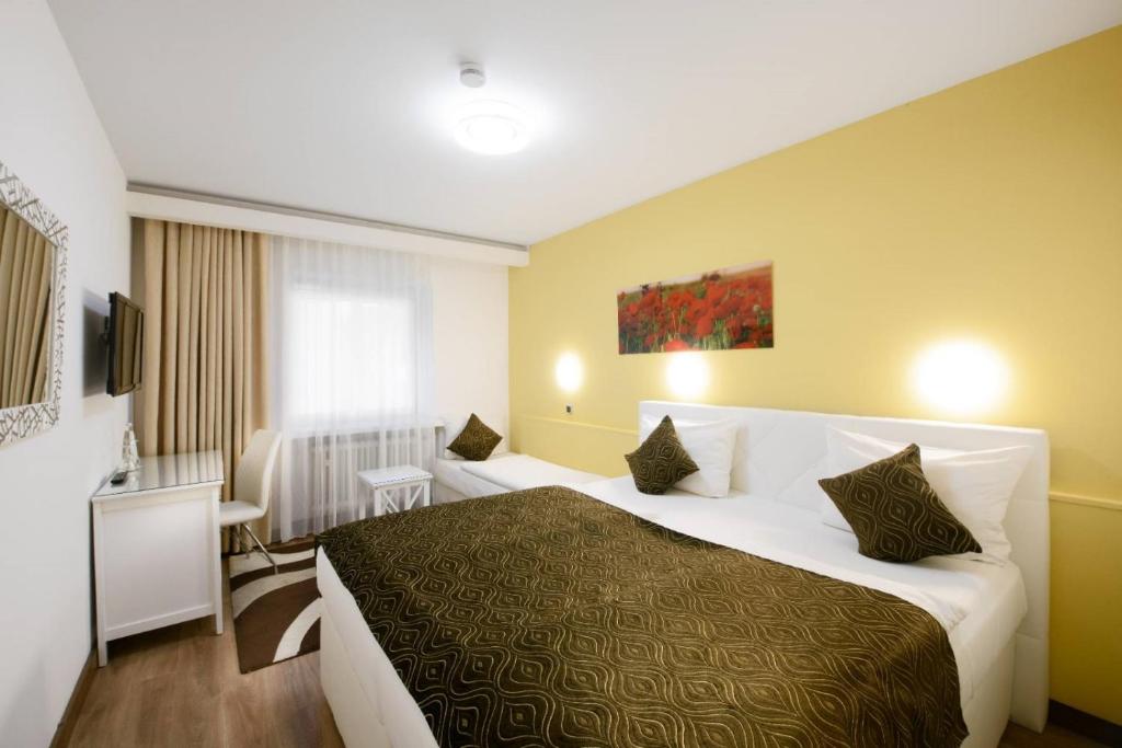 Postel nebo postele na pokoji v ubytování Hotel Rivoli Charme