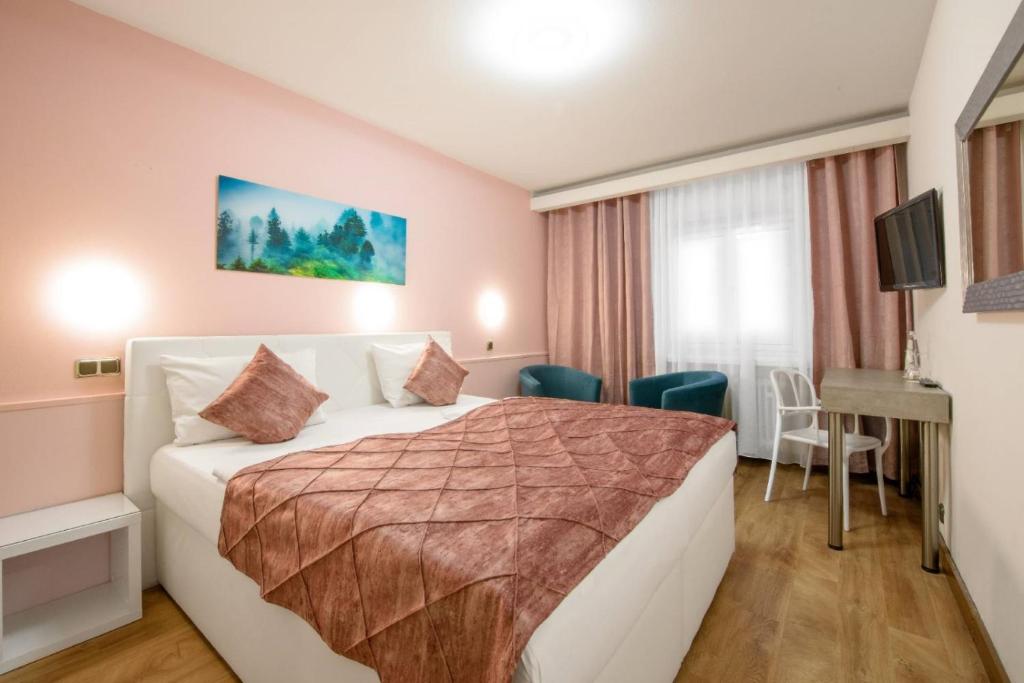 Postel nebo postele na pokoji v ubytování Hotel Rivoli Charme
