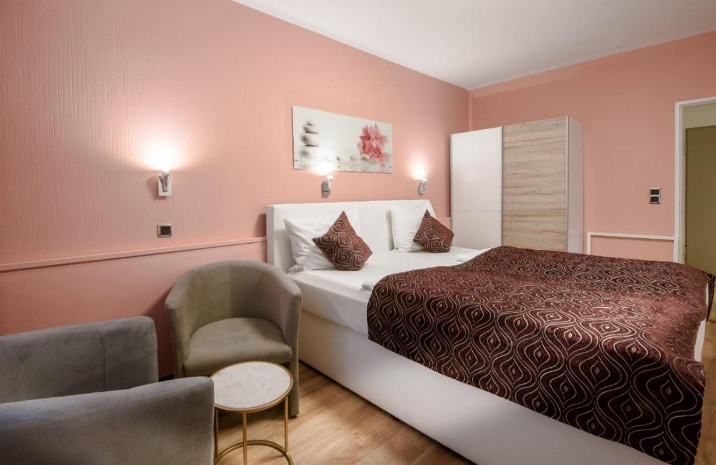 Postel nebo postele na pokoji v ubytování Hotel Rivoli Charme