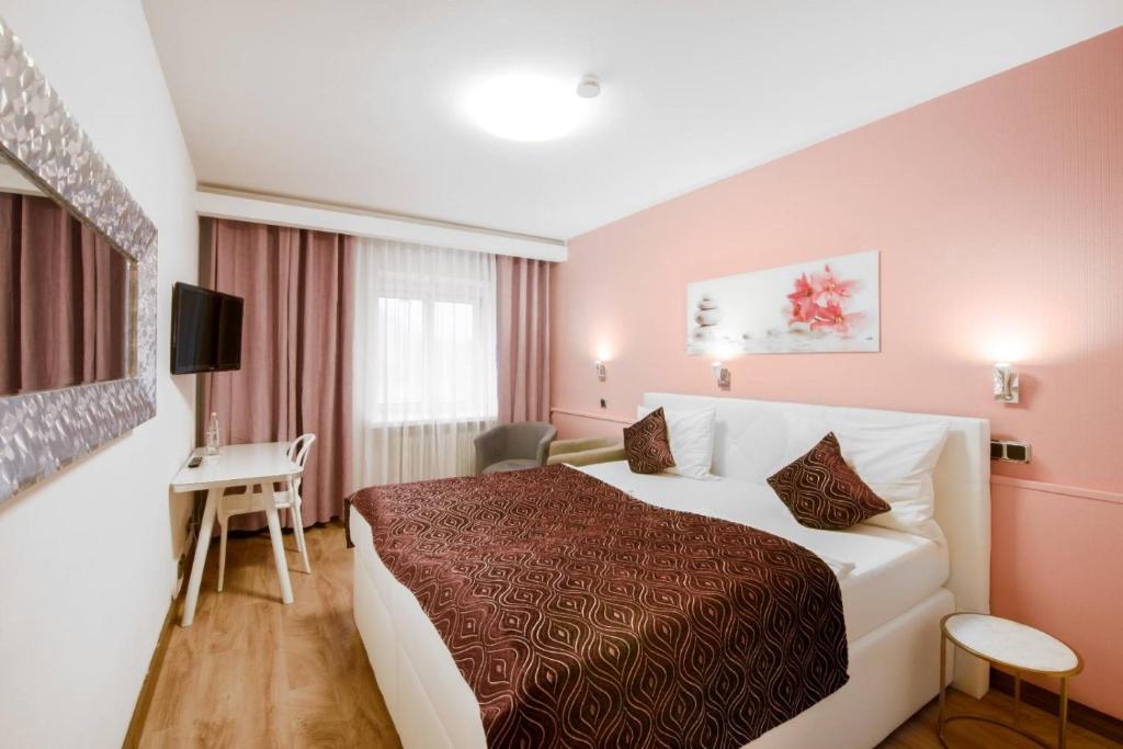 Postel nebo postele na pokoji v ubytování Hotel Rivoli Charme