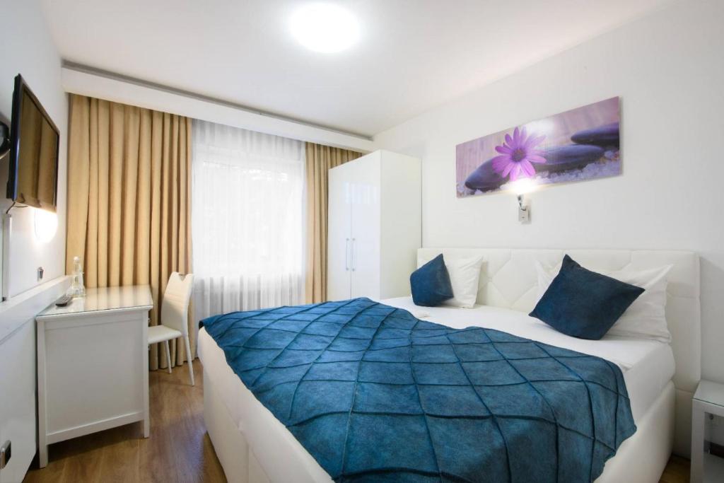 Postel nebo postele na pokoji v ubytování Hotel Rivoli Charme