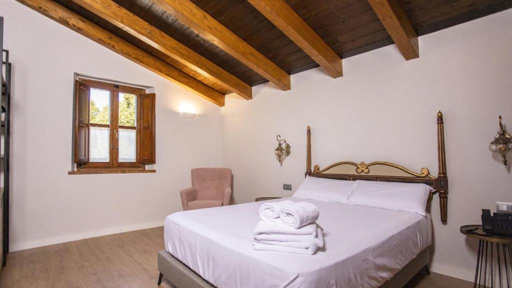 Postel nebo postele na pokoji v ubytování Abbatissa Hotel Restaurant