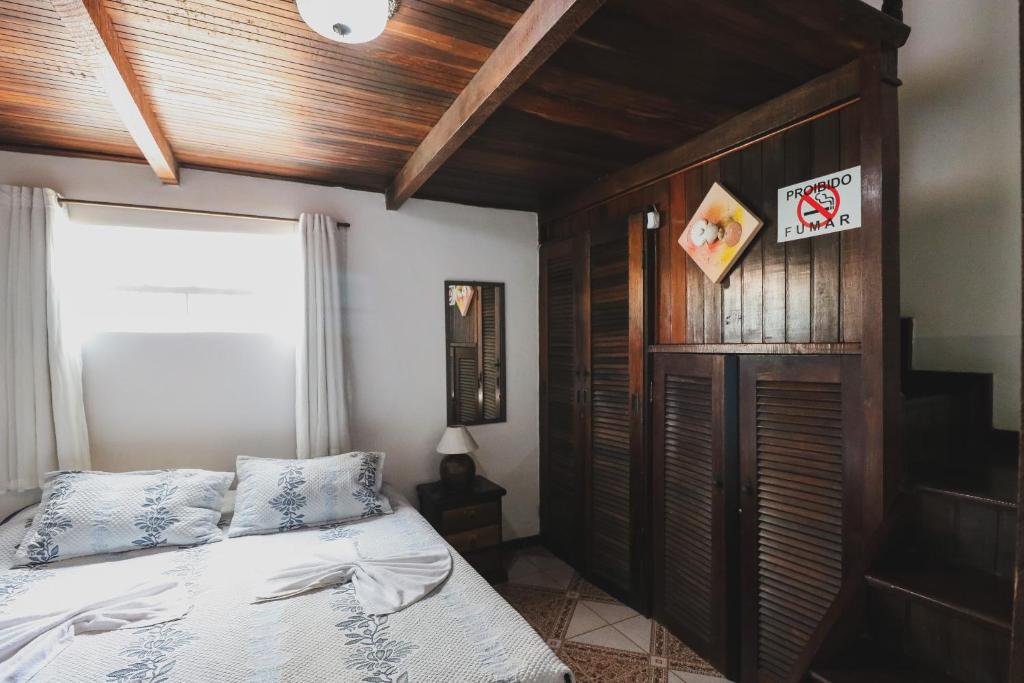 Cama ou camas em um quarto em Hostel Cabo Frio