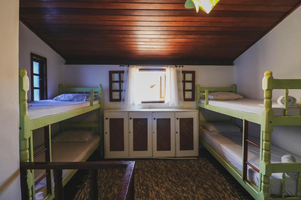 Cama ou camas em um quarto em Hostel Cabo Frio