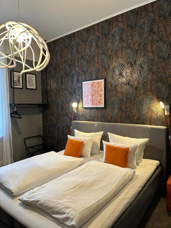 Postel nebo postele na pokoji v ubytování Hotel Maxplatz