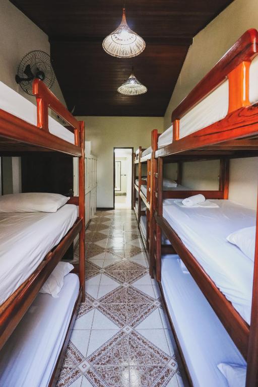 Cama ou camas em um quarto em Hostel Cabo Frio