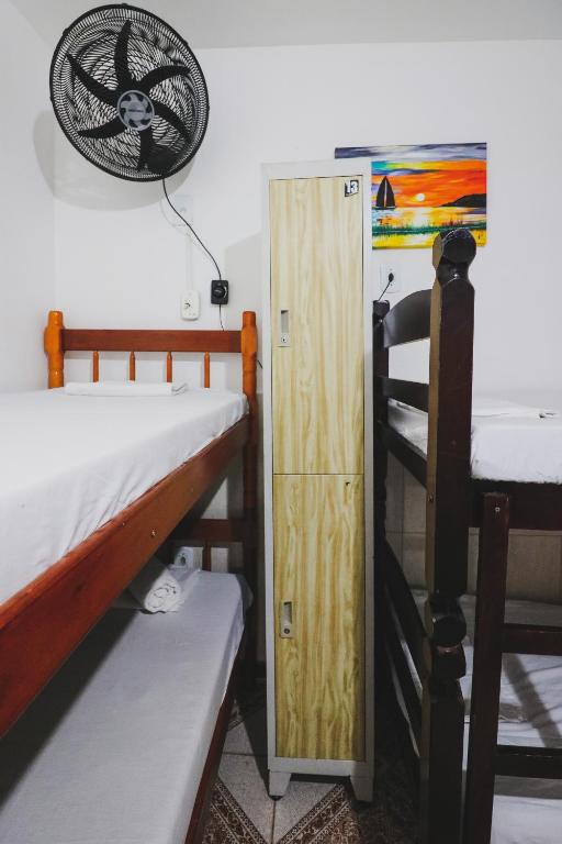 Cama ou camas em um quarto em Hostel Cabo Frio