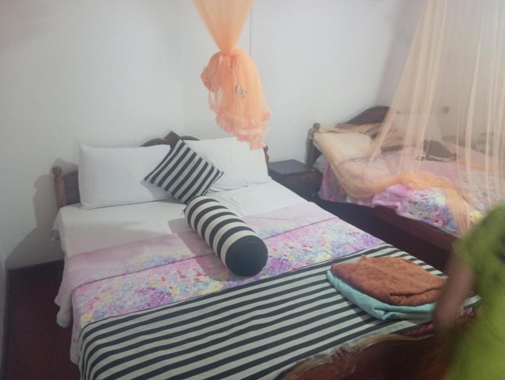 Postel nebo postele na pokoji v ubytování Forest Paddy Homestay