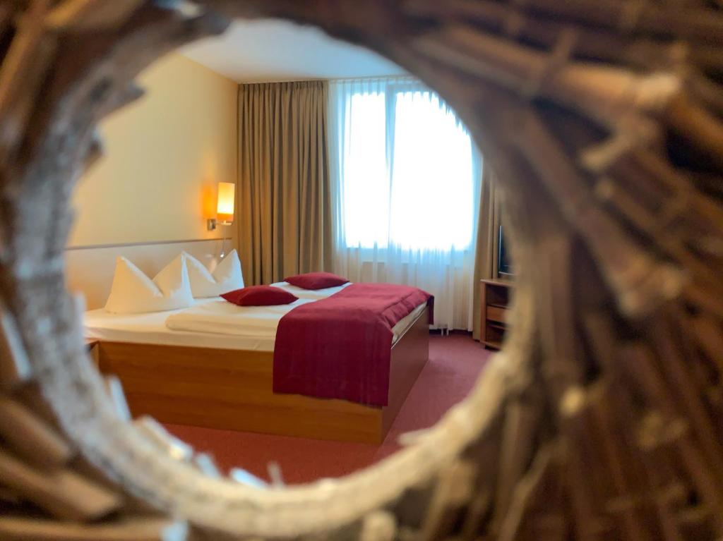 Postel nebo postele na pokoji v ubytování Atrium Hotel Krüger