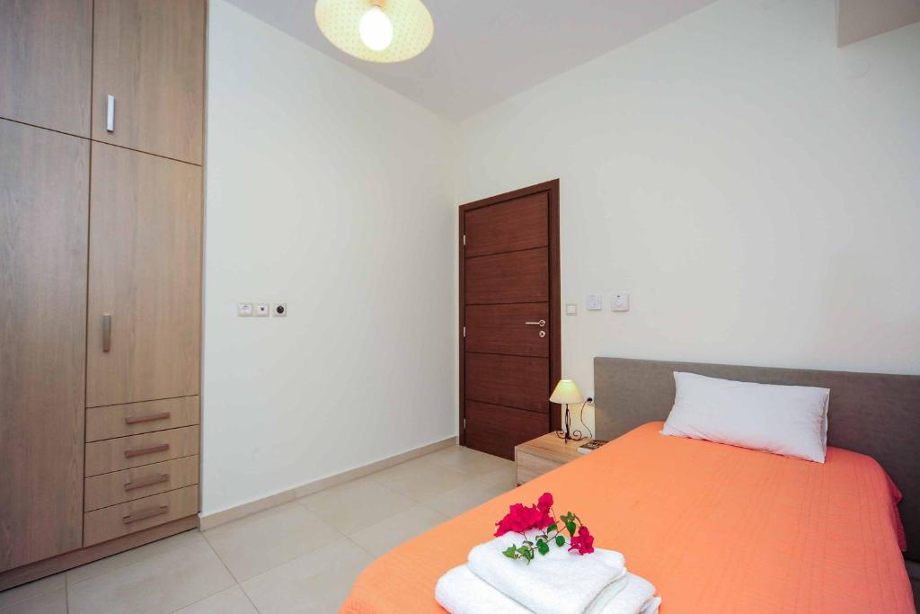 A bed or beds in a room at Villa Orsalia