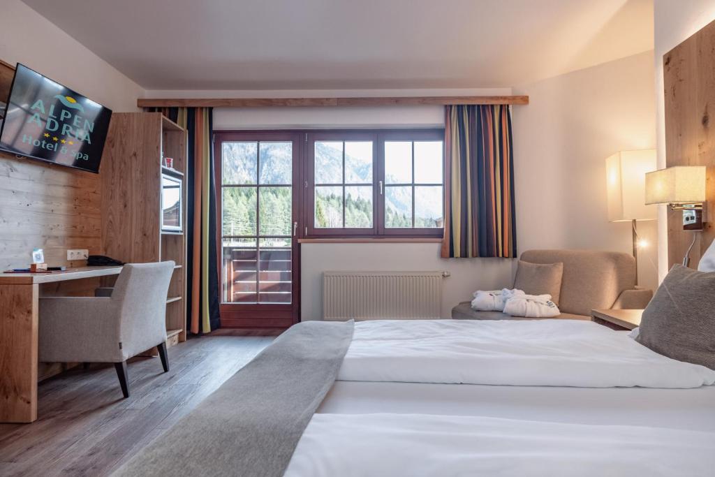 Postel nebo postele na pokoji v ubytování Alpen Adria Hotel & Spa