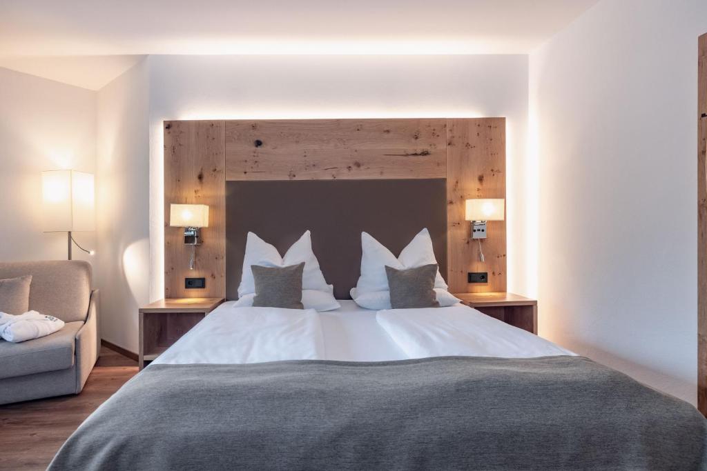 Postel nebo postele na pokoji v ubytování Alpen Adria Hotel & Spa