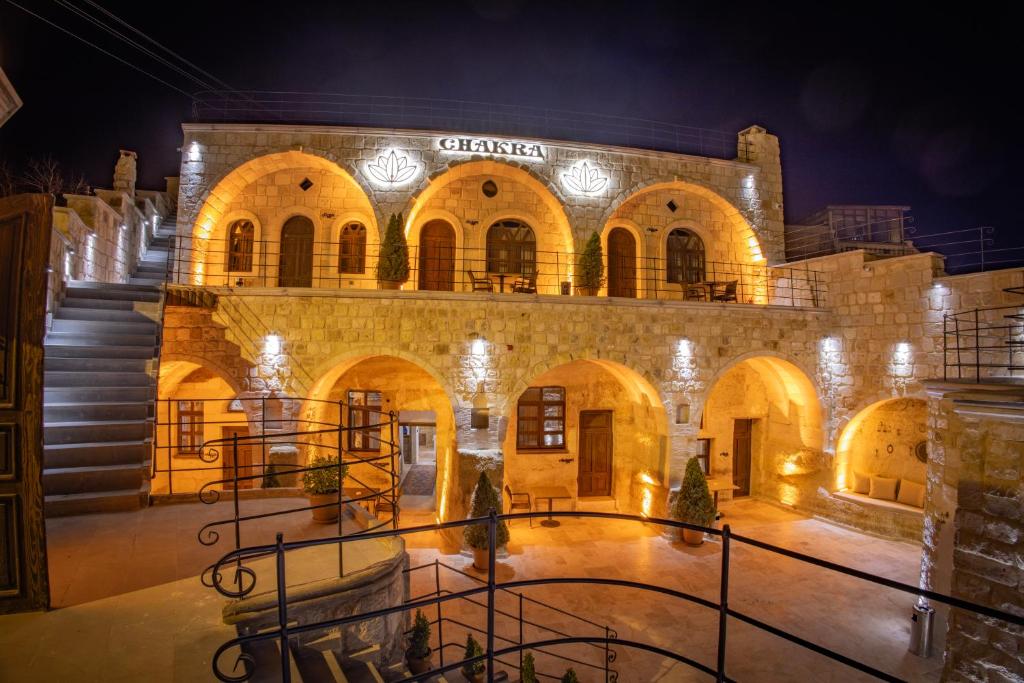 a building with a staircase in front of it at night at Chakra Special Caves in Ürgüp