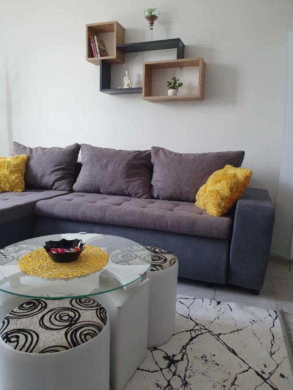 a living room with a couch and a table at Apartman Djokic 3 in Požarevac