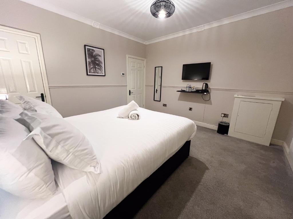Katil atau katil-katil dalam bilik di The Exchange Hotel