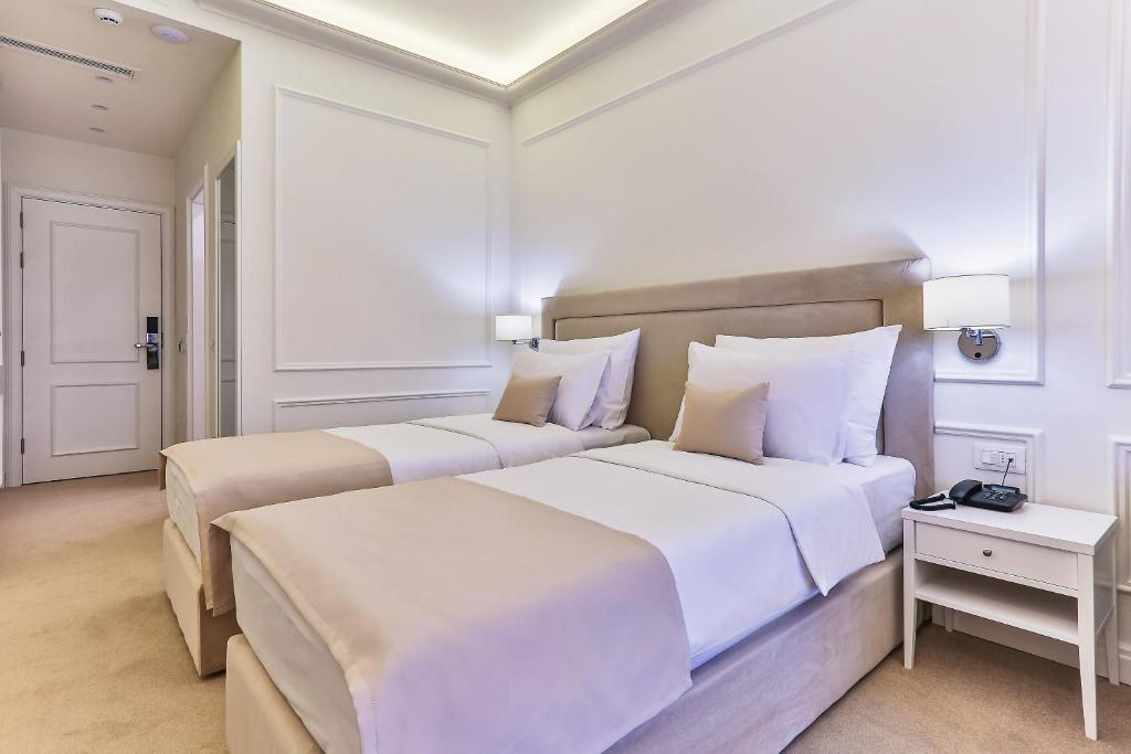 Postel nebo postele na pokoji v ubytování Hotel EDEN
