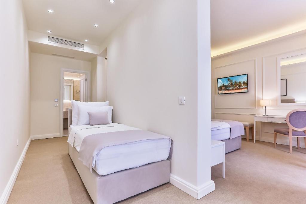 Postel nebo postele na pokoji v ubytování Hotel EDEN