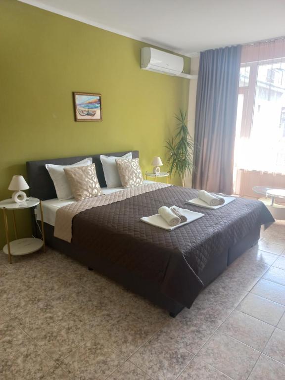 A bed or beds in a room at Guest House Pomorie