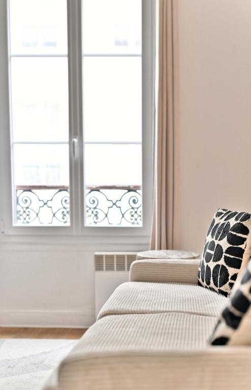 Posteľ alebo postele v izbe v ubytovaní Appartement Champ de Mars - Augereau