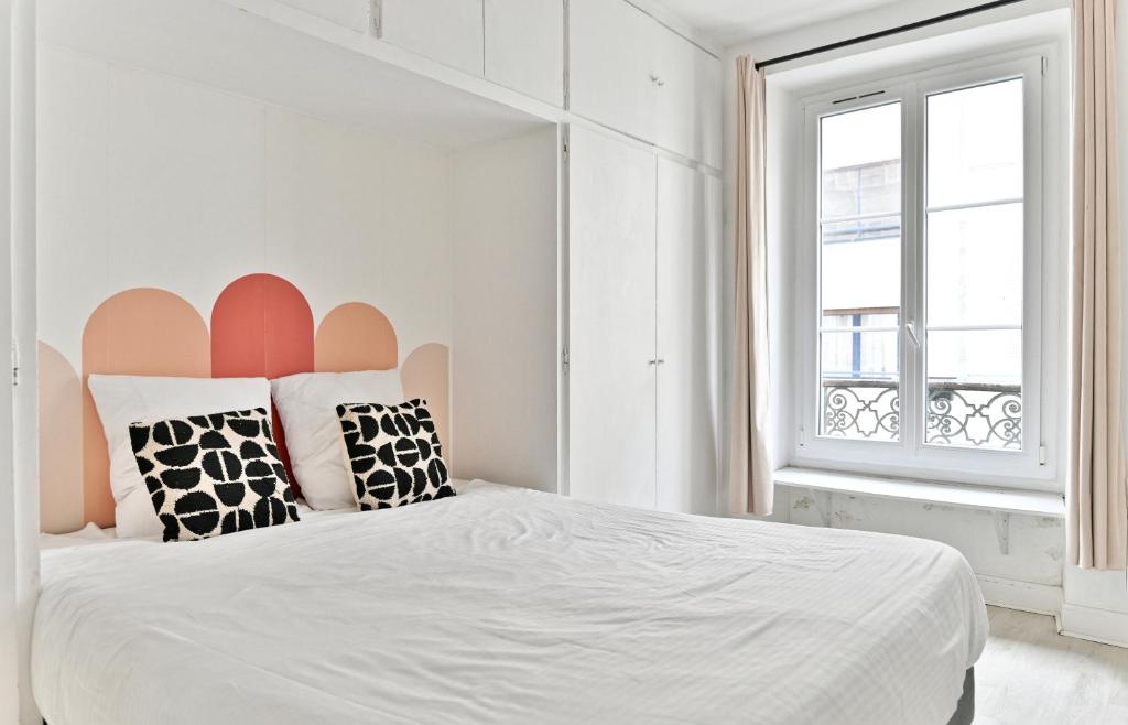 Posteľ alebo postele v izbe v ubytovaní Appartement Champ de Mars - Augereau