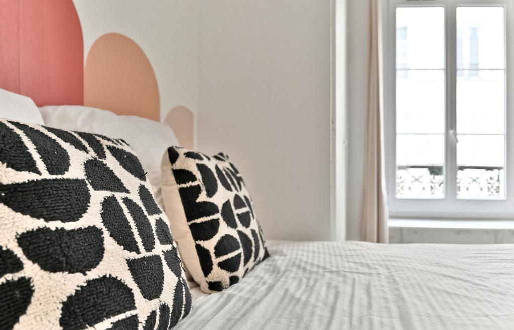 Posteľ alebo postele v izbe v ubytovaní Appartement Champ de Mars - Augereau