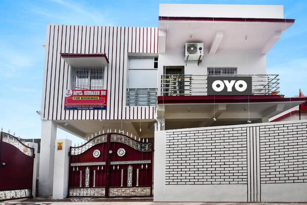 a white building with an ovo sign on it at OYO Flagship Hotel Rudraksh Inn in Rānchī
