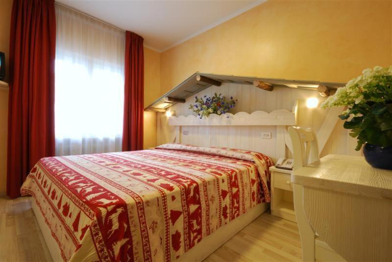Postel nebo postele na pokoji v ubytování Hotel Bellaria