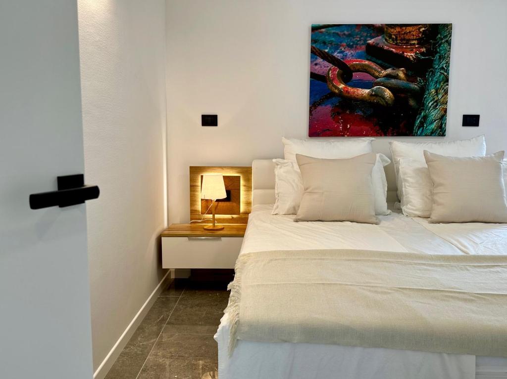 Postel nebo postele na pokoji v ubytování Apartments E&T by Locap Group