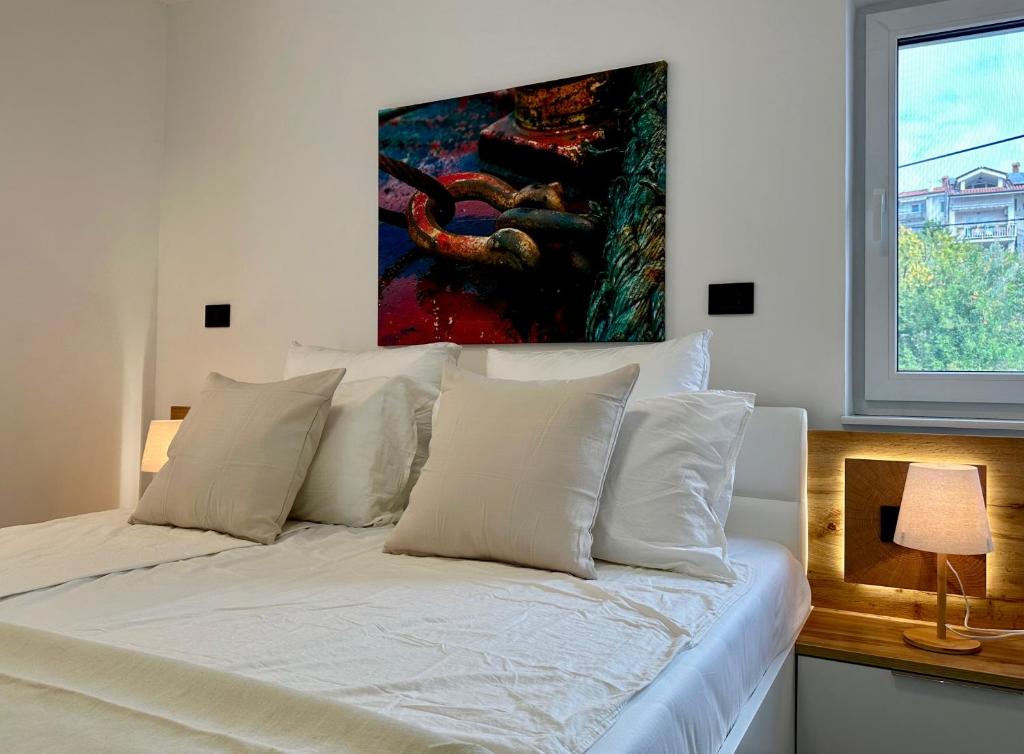 Postel nebo postele na pokoji v ubytování Apartments E&T by Locap Group