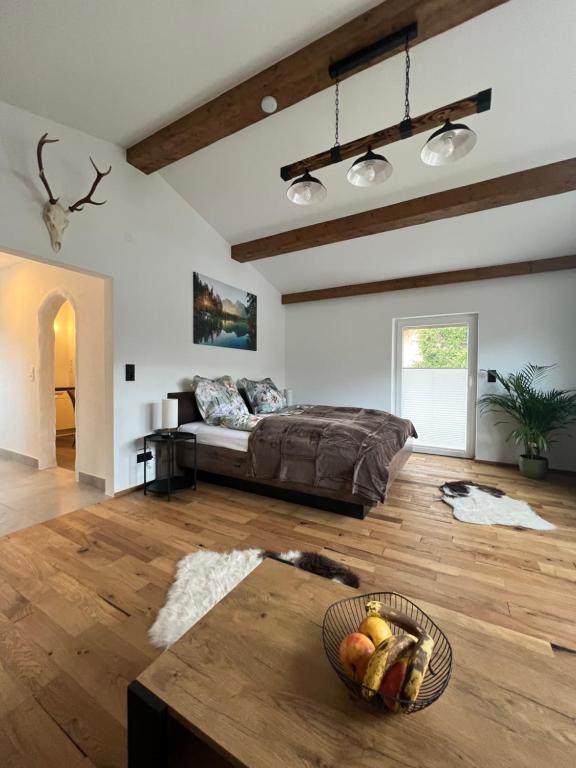 a living room with a couch and a bowl of fruit at Cityapartments Reutte in Reutte