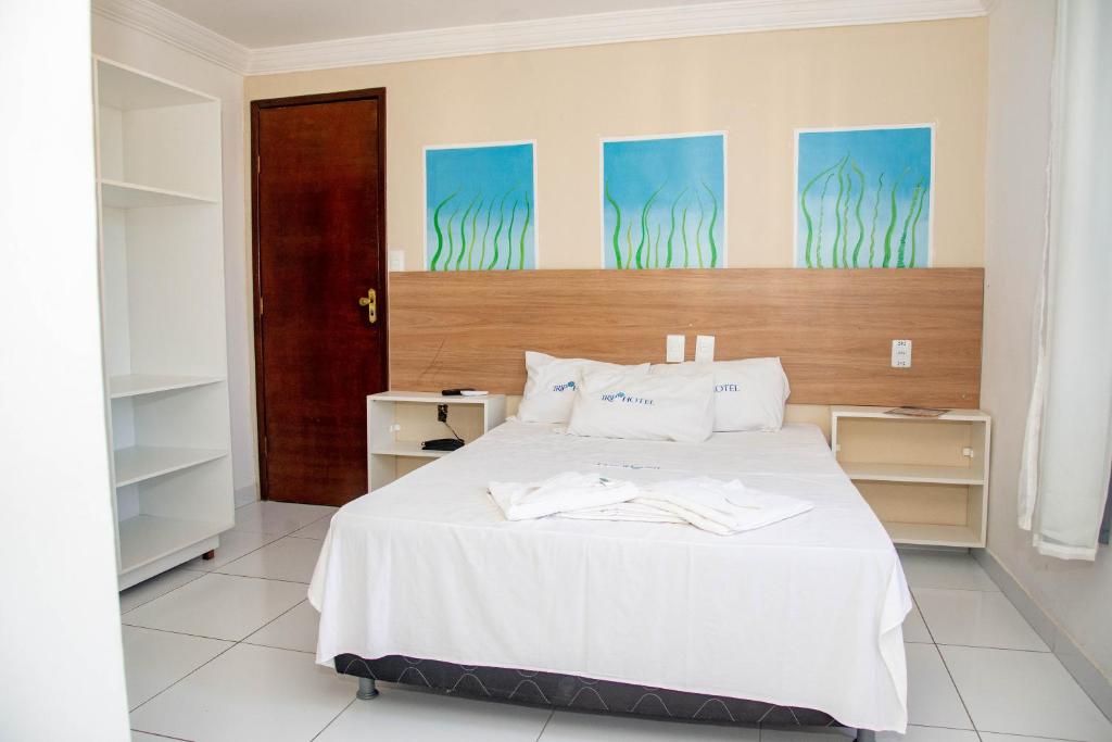 En eller flere senge i et værelse på Trip Hotel Lauro de Freitas