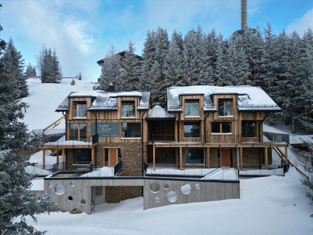 a log home in the snow with snow at Ski-in/Ski-Out Chalet Hauser Kaibling in Gumpenberg